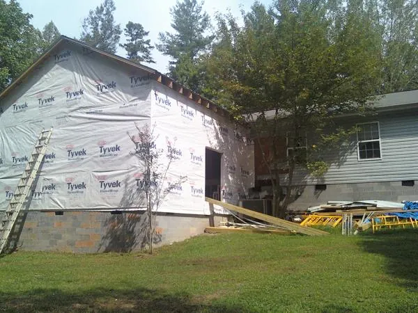 Tyvek wrapped gable on a new room addition beside an existing home in Bethlehem